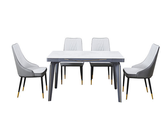 O metal embutiu a mesa de jantar superior da ardósia luxuosa clara da rocha